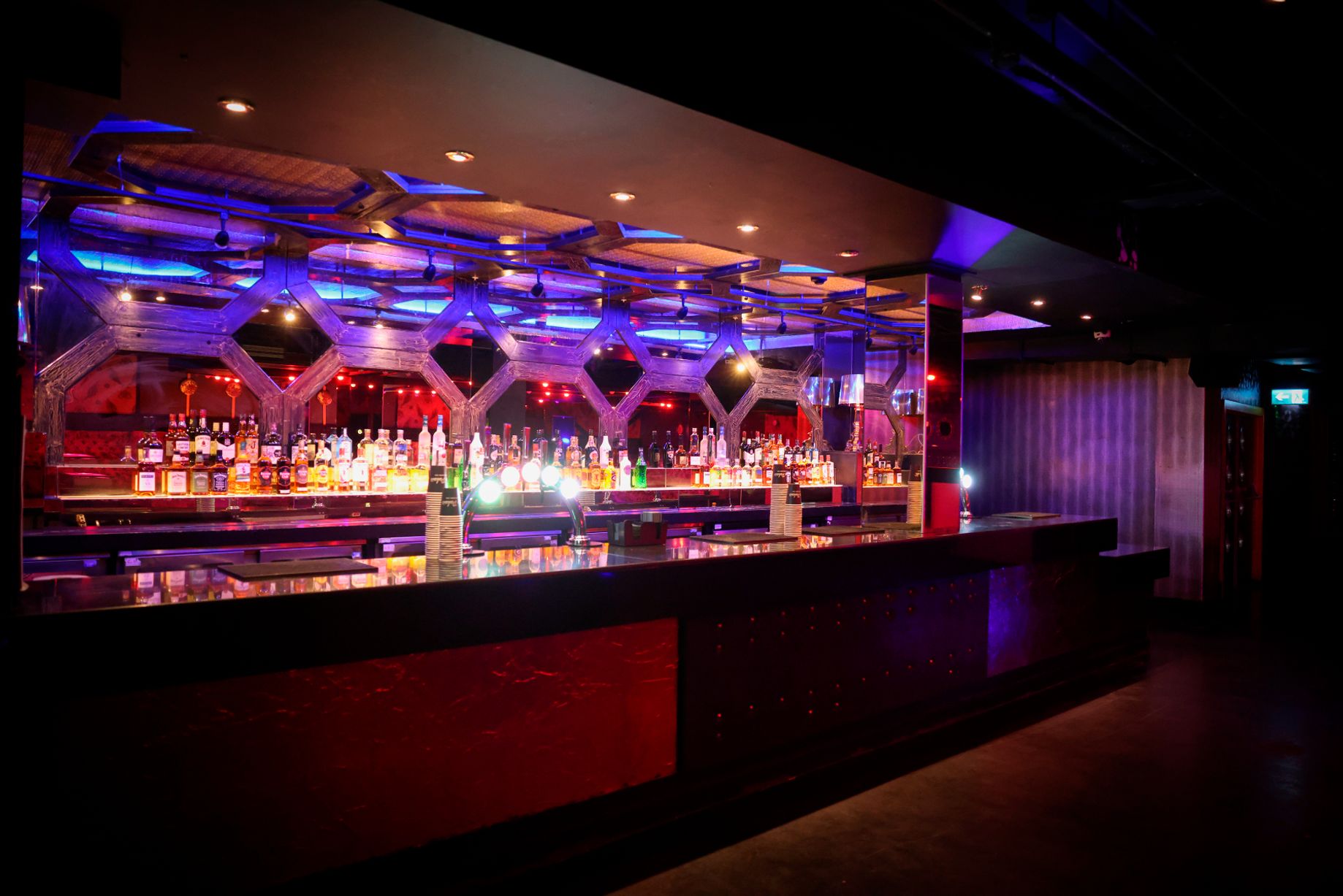 Modern bar in Palais Nottingham, vibrant lighting for cocktail receptions and networking events.