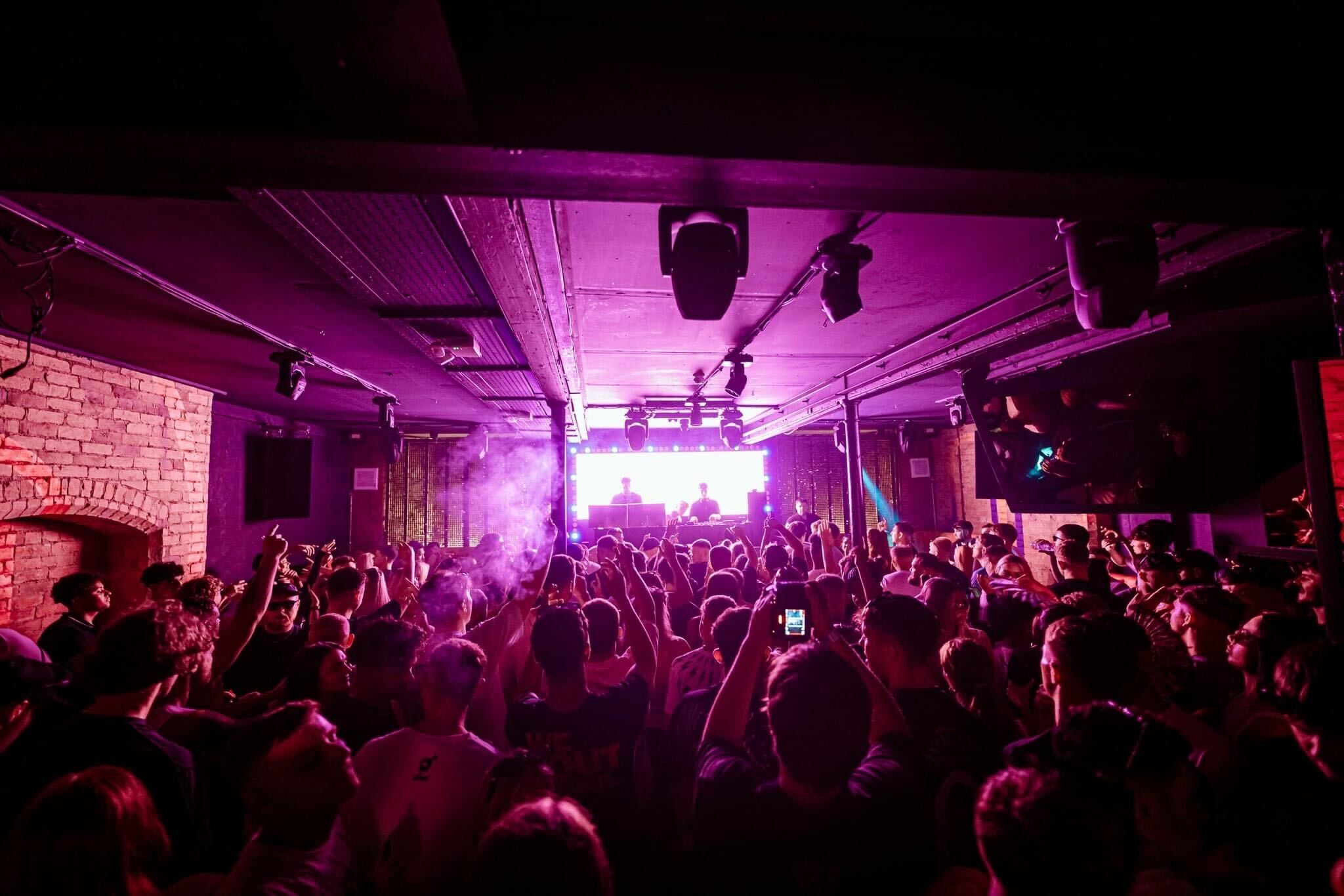 Energetic crowd at Boudoir live music event, vibrant atmosphere for engagement and interaction.