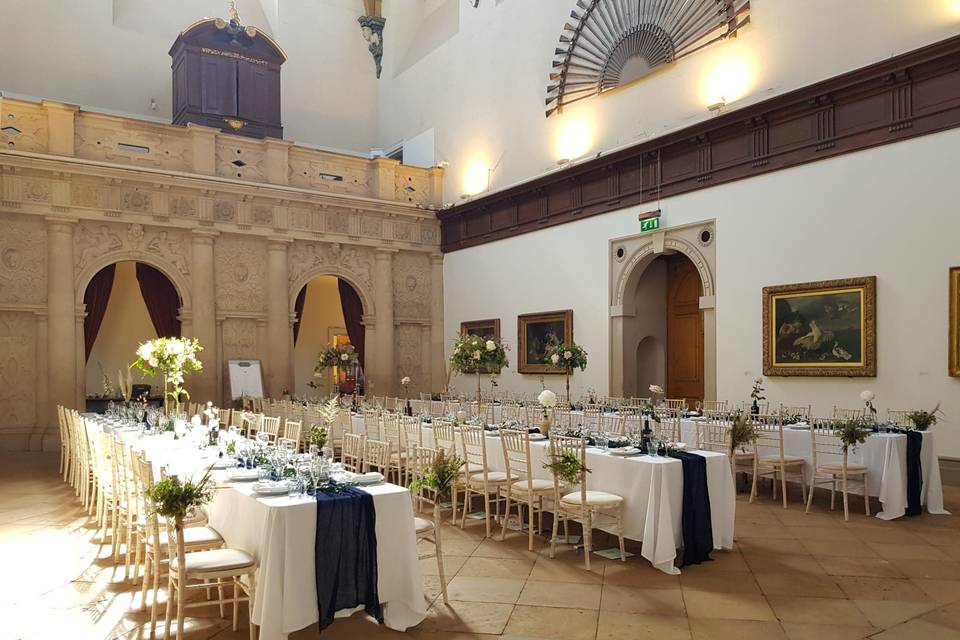 Great Hall at Wollaton Hall with elegant tables for weddings and corporate events.