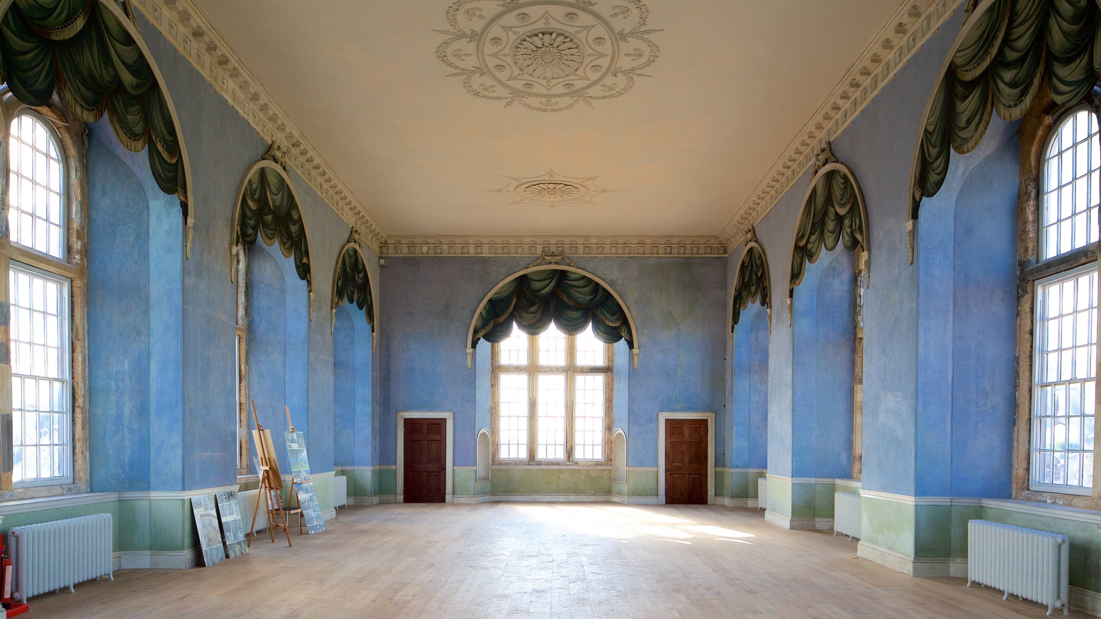 Lady's Chamber at Wollaton Hall, featuring high ceilings, elegant event space for gatherings.