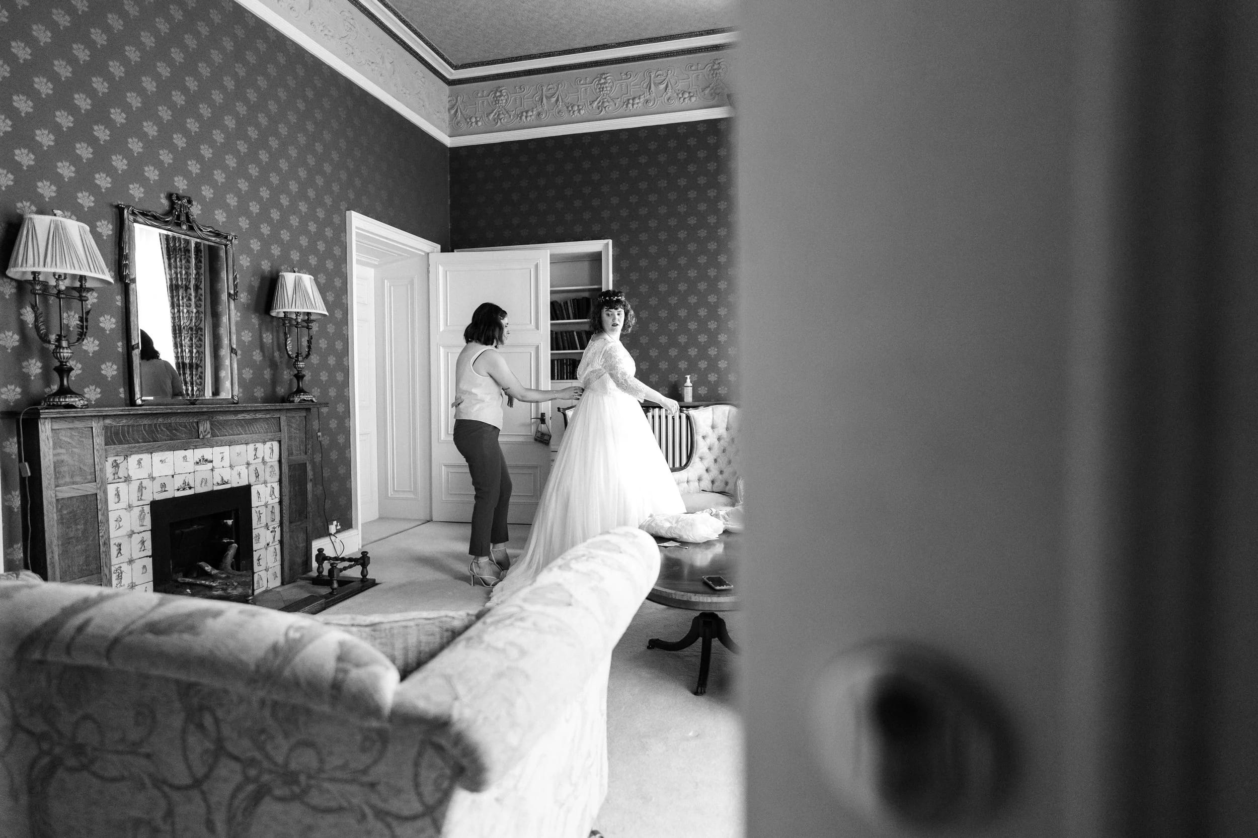 Bride in wedding dress in elegant Lady's Chamber, perfect for memorable weddings.