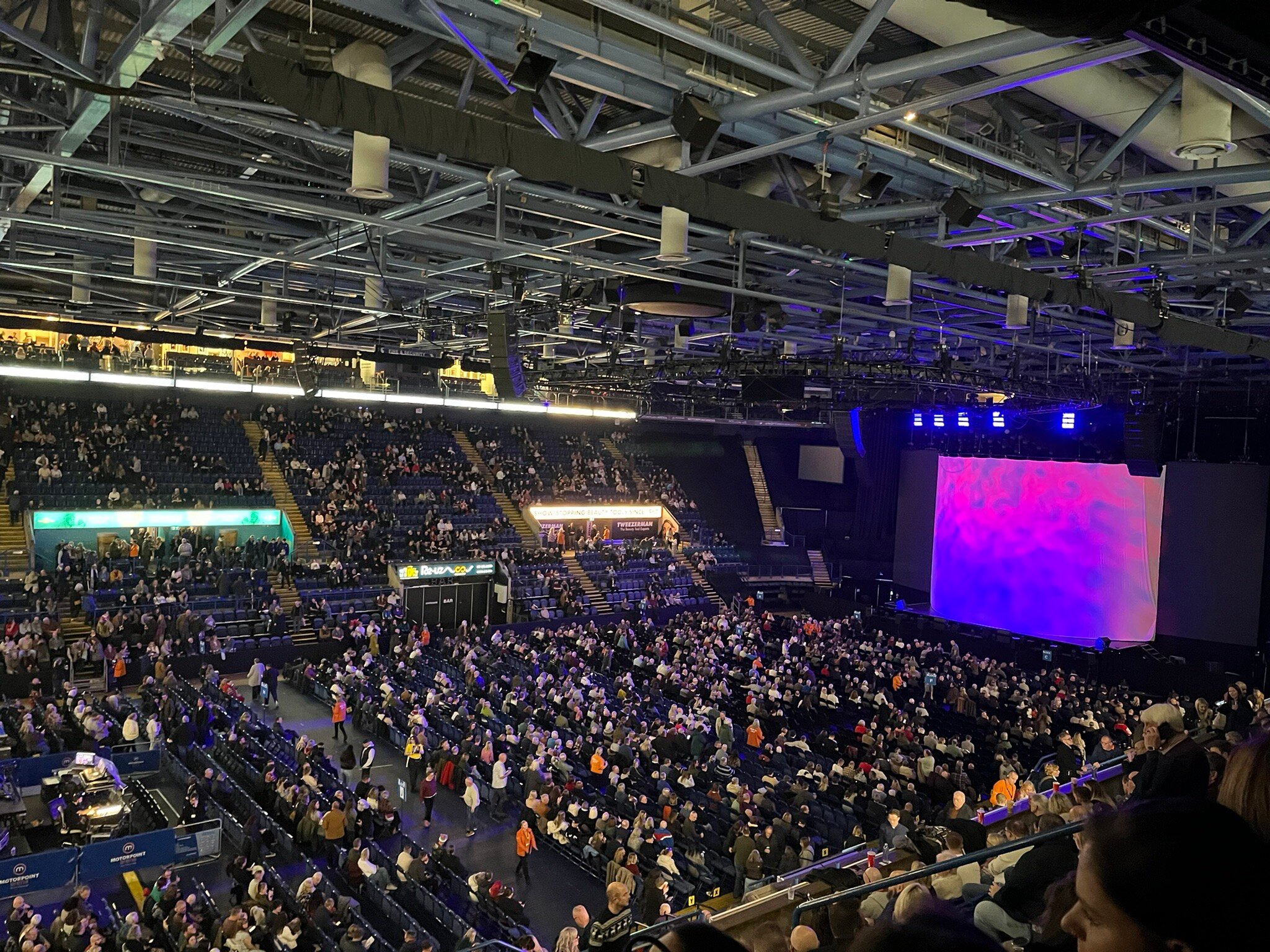Packed Motorpoint Arena Nottingham with focused lighting for an engaging event experience.