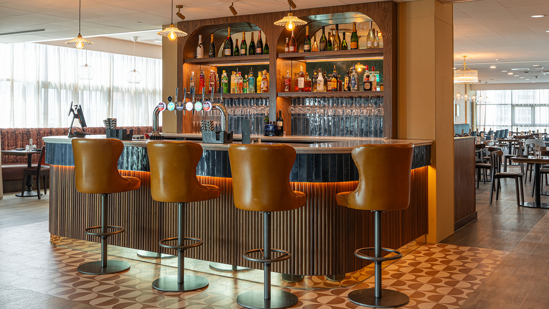 Stylish bar in Executive Suites at Motorpoint Arena, perfect for networking events and gatherings.