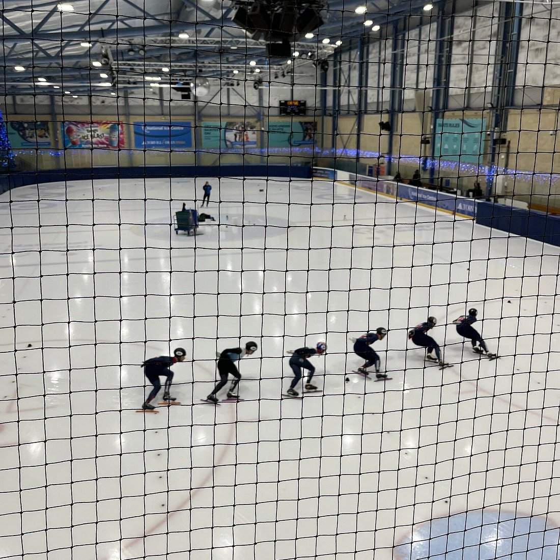 Speed skaters practice at National Ice Centre for corporate winter sports events.