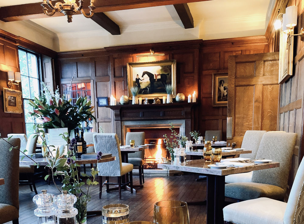 Oak Room at Burleigh Court with fireplace for exclusive board meetings and private dining.