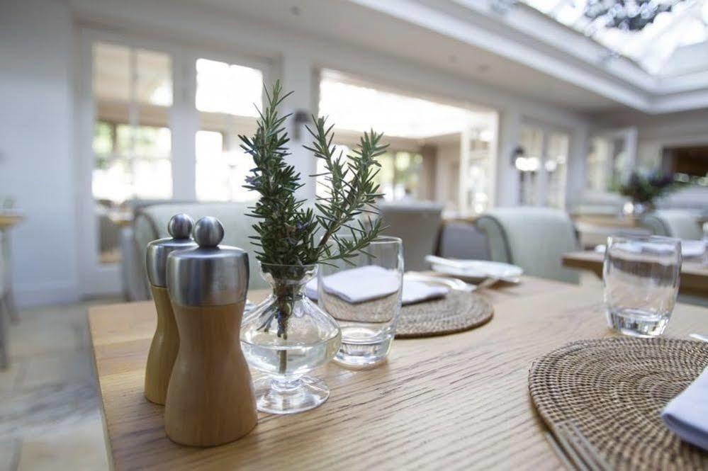 Private Dining Barn table with fresh herbs, perfect for corporate events or intimate gatherings.