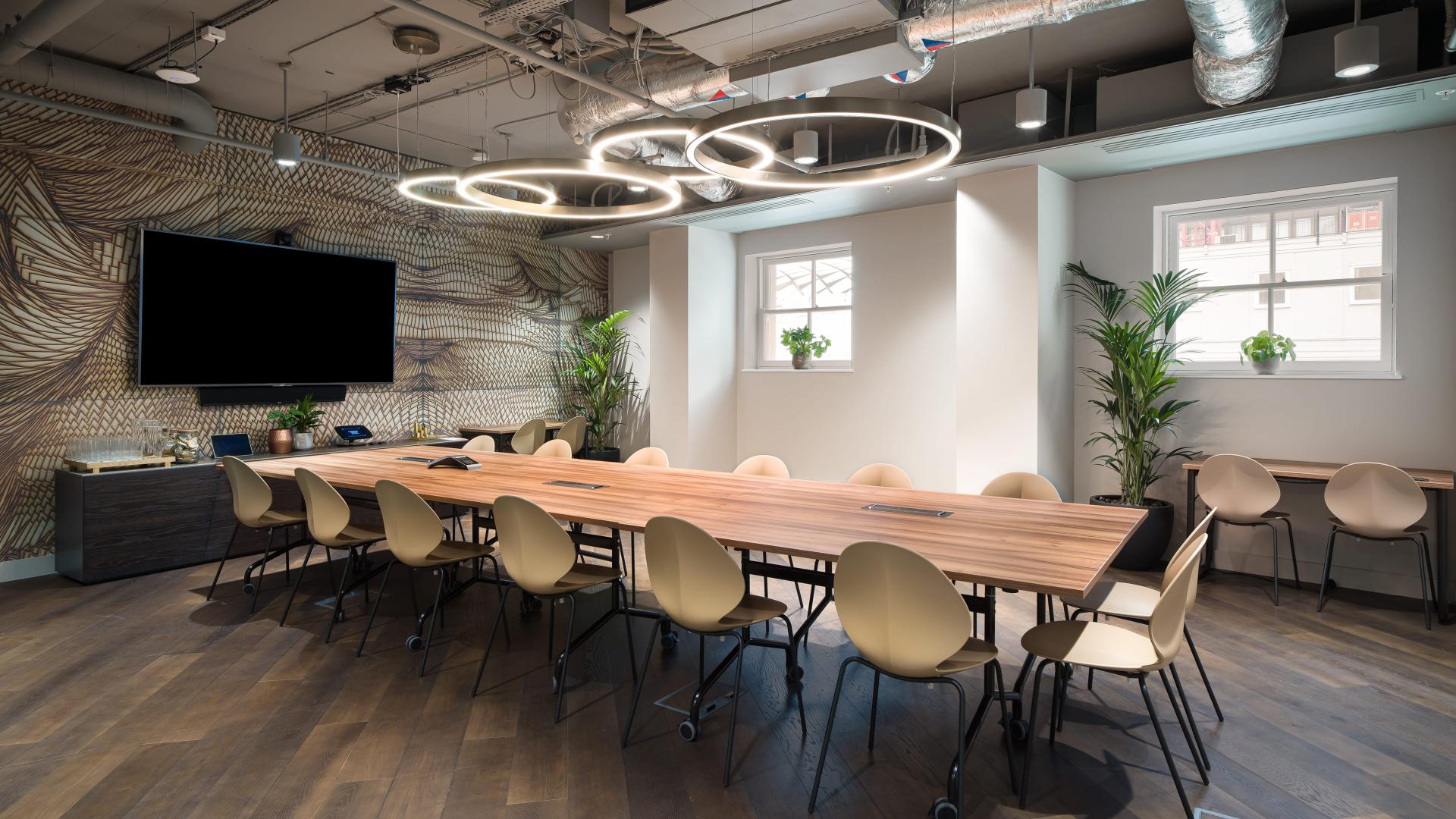 Modern conference room with wooden table, ideal for productive meetings and brainstorming.