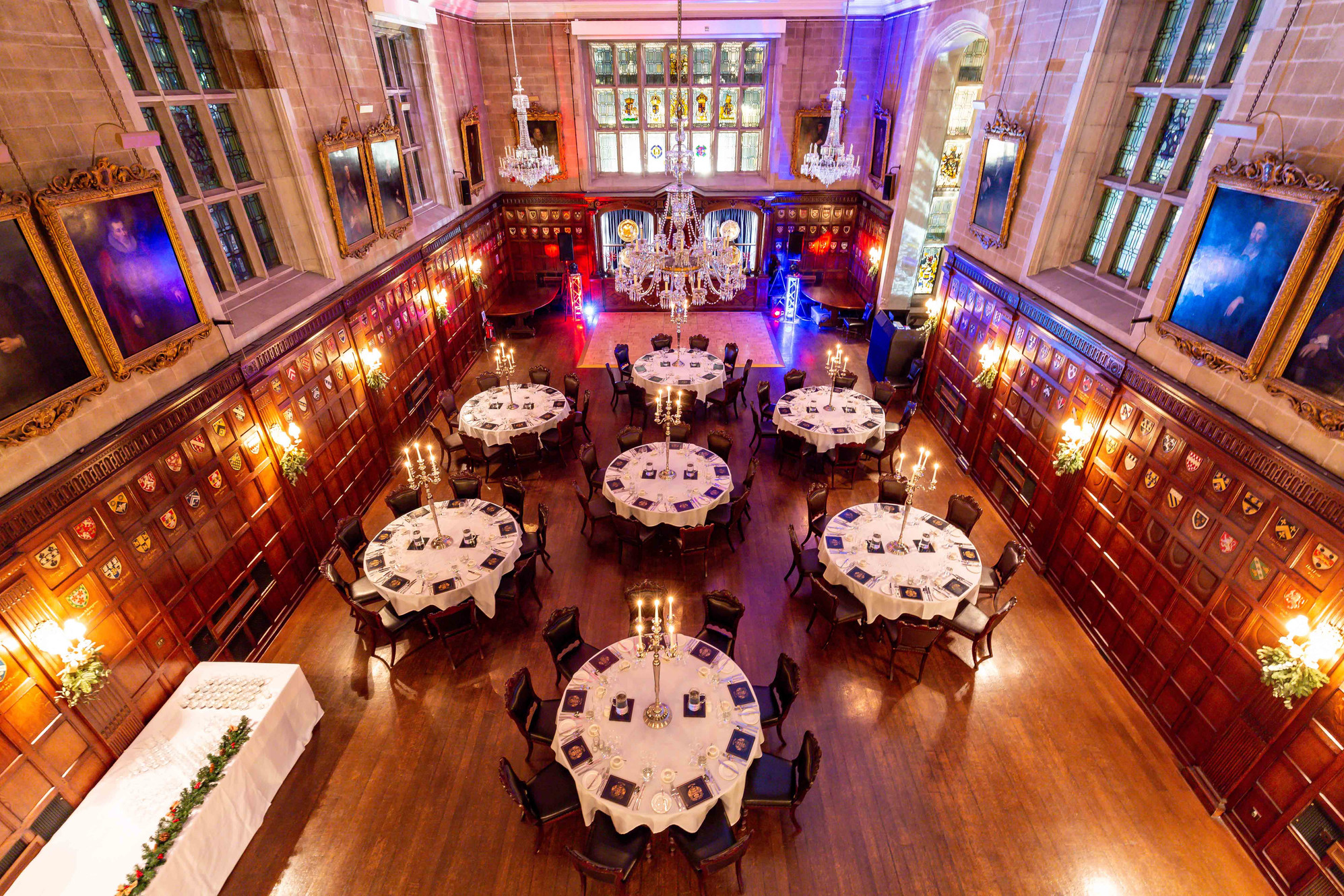 Elegant banquet hall with round tables set for formal events in Ironmongers' Hall.