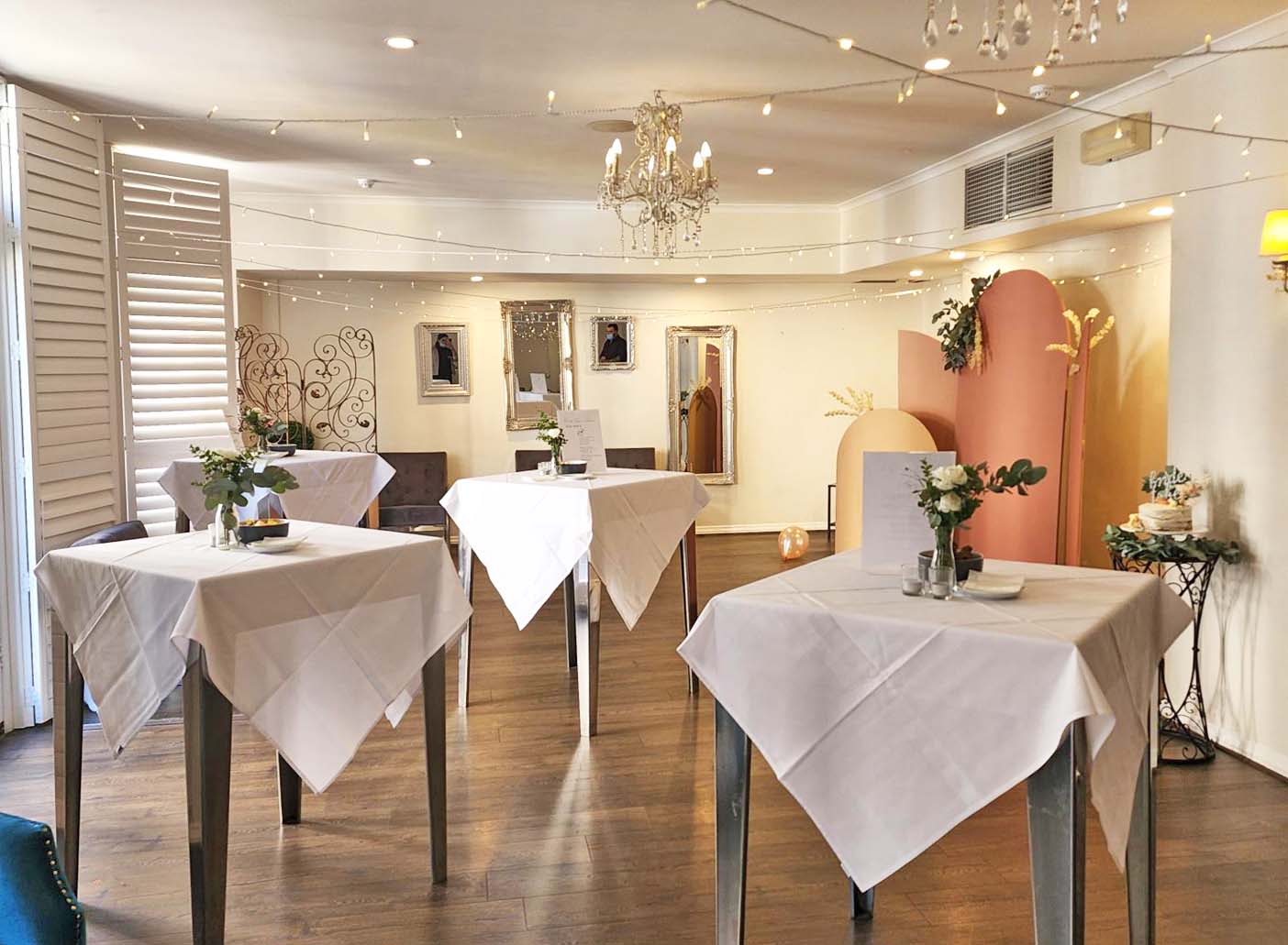 Henley Room cocktail setup with high-top tables for networking events and social mixers.