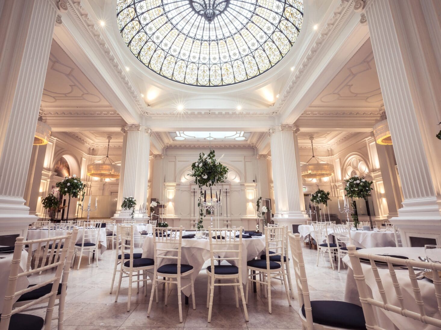 Elegant Banqueting Suite with stained glass ceiling for corporate events and gala dinners.