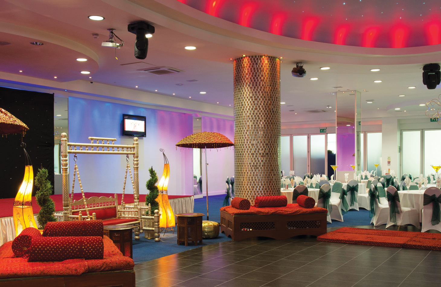 The Banqueting Suite in London, elegantly set for a gala with stylish décor and colorful lighting.