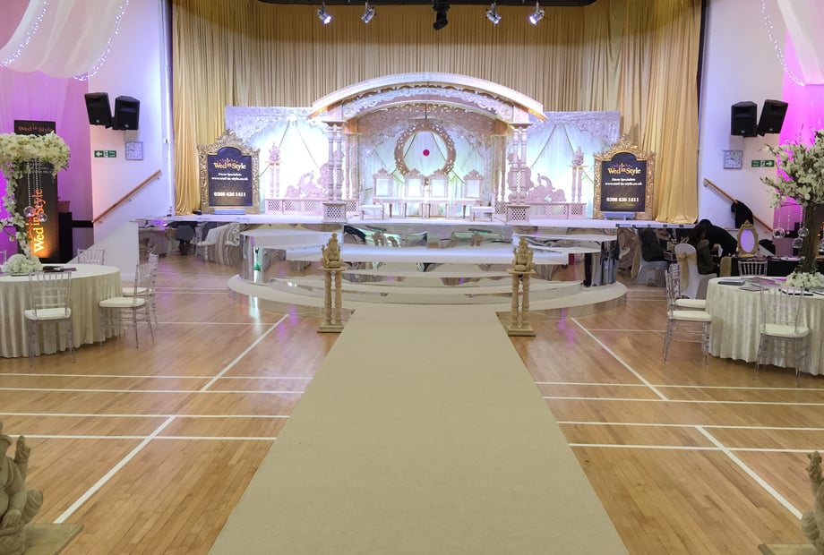 Elegant dining hall with floral decor, ideal for weddings and galas.