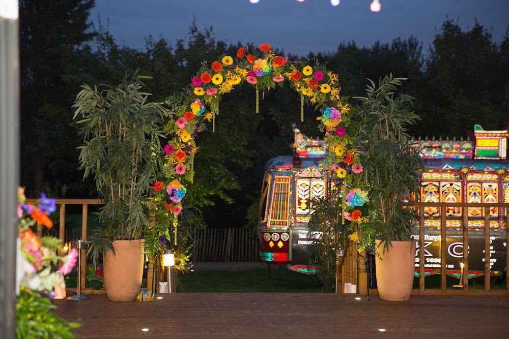Floral archway in Fairway Pavilion banquet hall, ideal for outdoor celebrations.