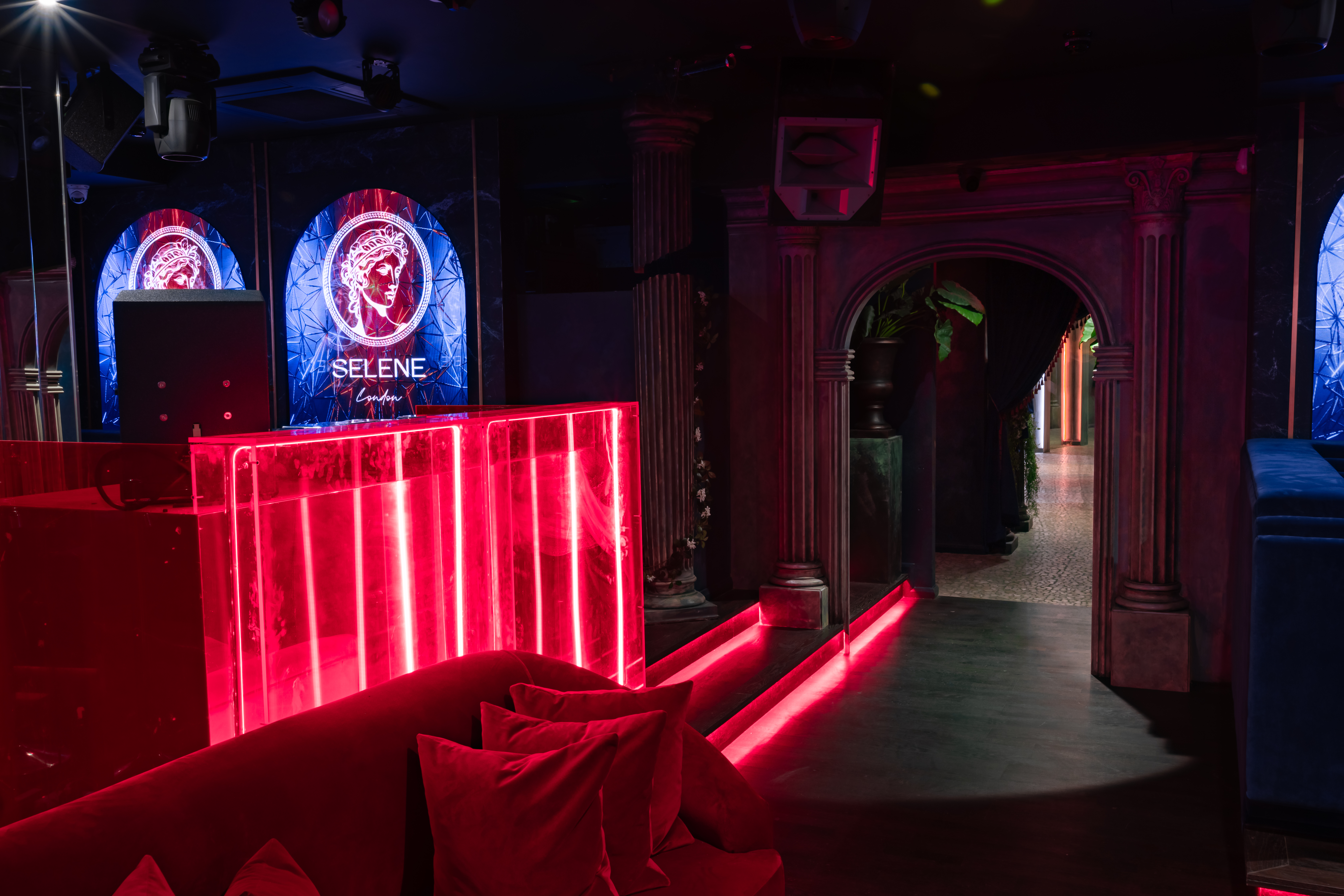 Stylish Selene Nightclub with vibrant red lighting for versatile events and gatherings.