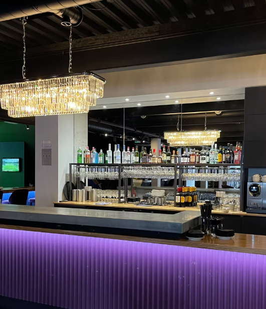 Stylish bar setup at Inner Drive Golf, ideal for networking events and cocktail receptions.