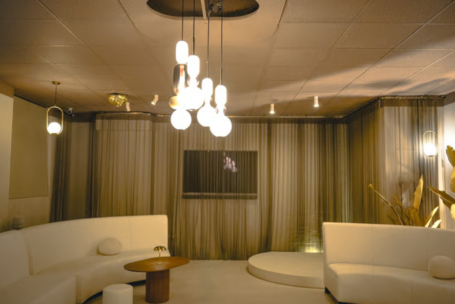 Luxury breakout lounge with plush curved seating for VIP networking and corporate events.