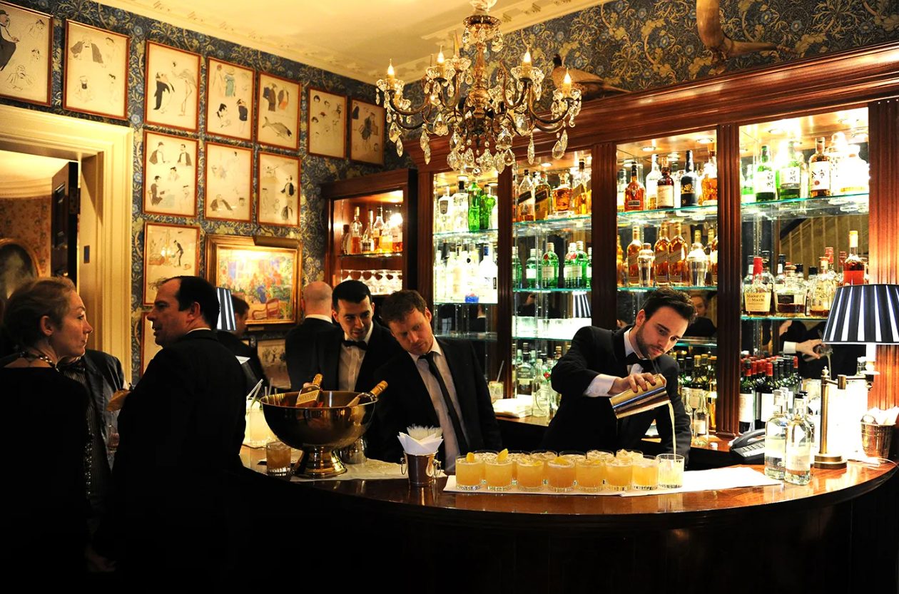 Upscale cocktail reception at Mark’s Club featuring premium beverage service for networking events.