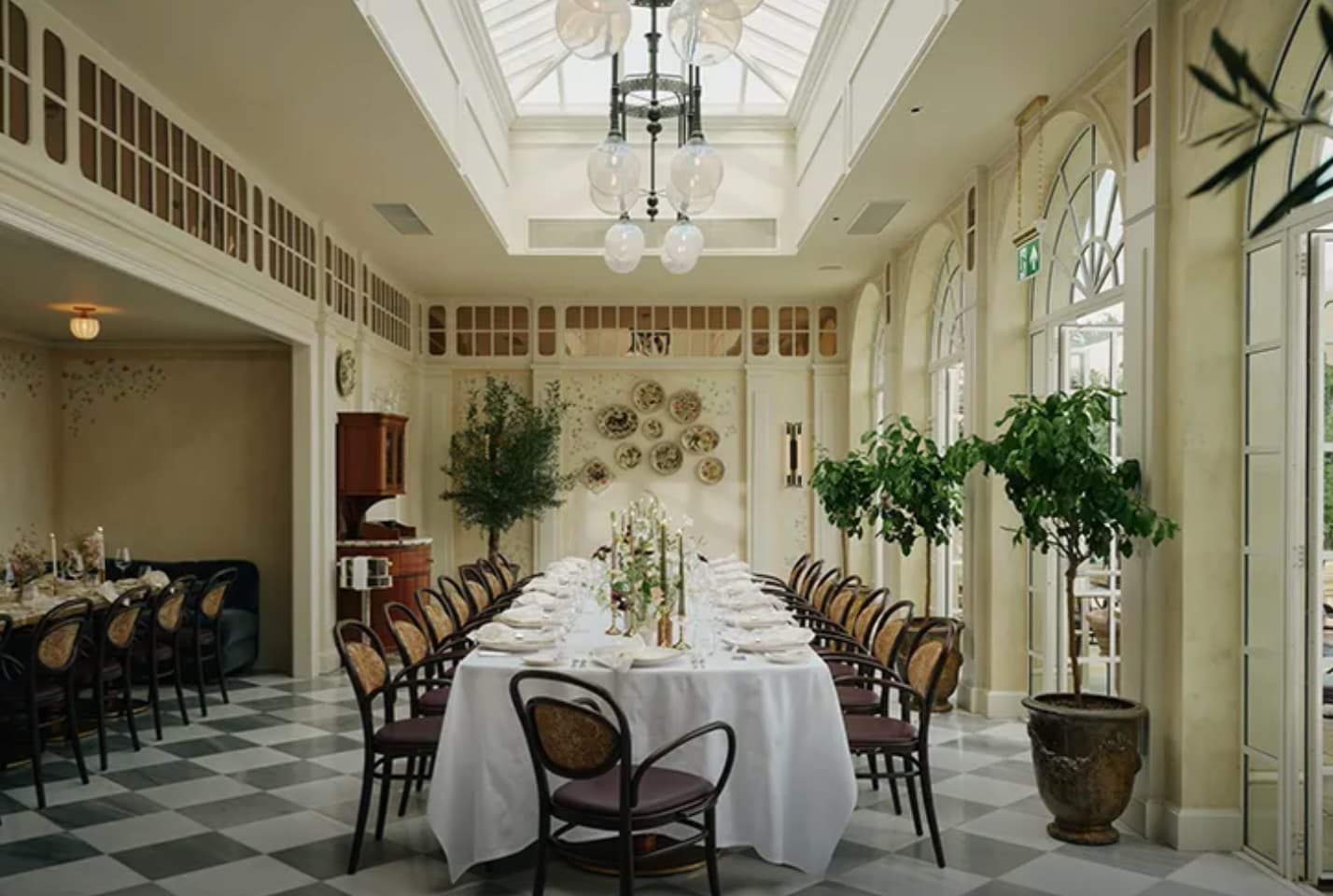 Elegant Maison Estelle dining room with checkerboard floors for corporate lunch or bridal events.