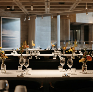 Lasdun Restaurant dining space with elegant tables for corporate events and celebrations.