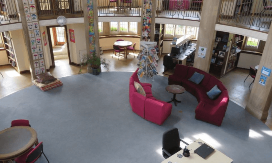 Weybridge Conference Room, spacious venue for meetings and workshops, featuring natural light.