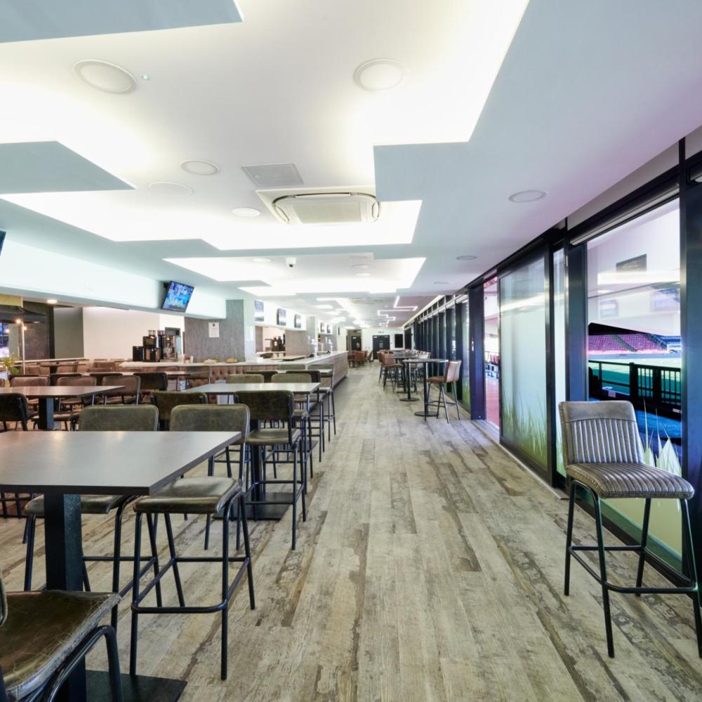 Modern event space at Watford F.C. with natural light, ideal for meetings and networking.