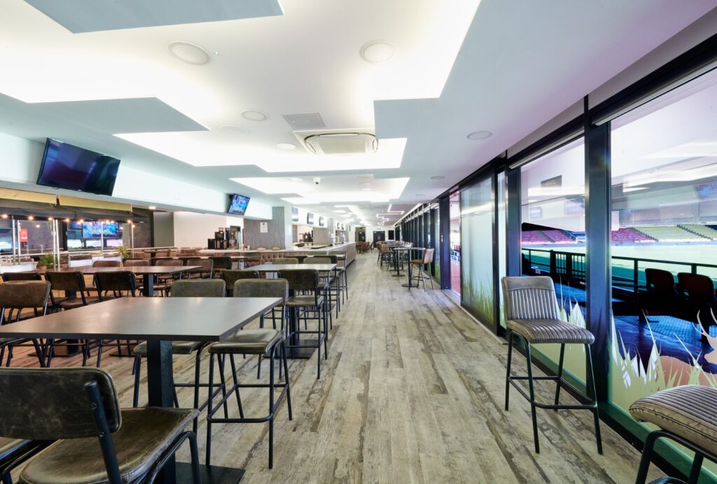 Modern event space at Watford F.C. with natural light, ideal for meetings and events.