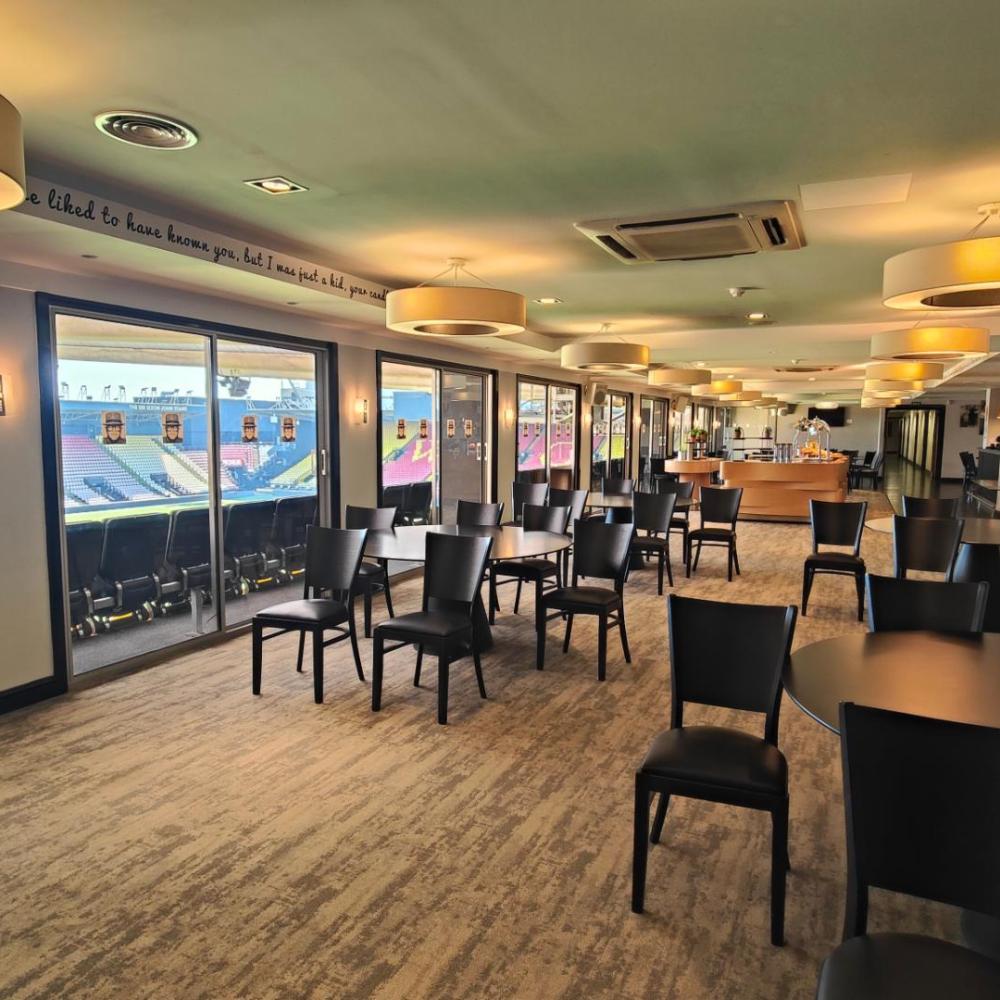 Versatile event space at Watford F.C. with natural light for corporate gatherings.