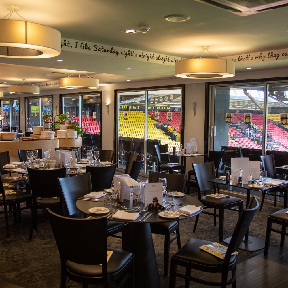 Sophisticated event space at Watford F.C. with elegant dining and stadium views.