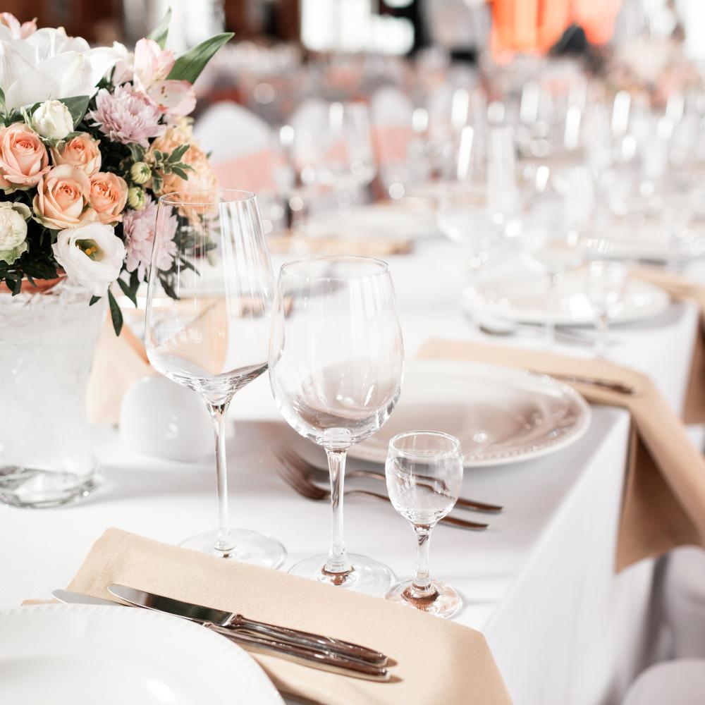 Elegant table setup at Watford F.C. for upscale meetings and events, featuring floral arrangements.