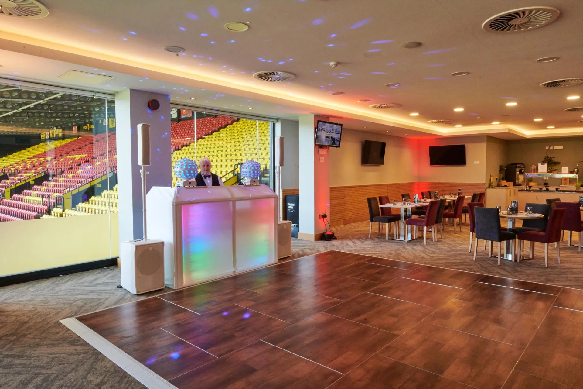 Event space at Watford F.C. with sleek bar & dance floor for meetings and celebrations.