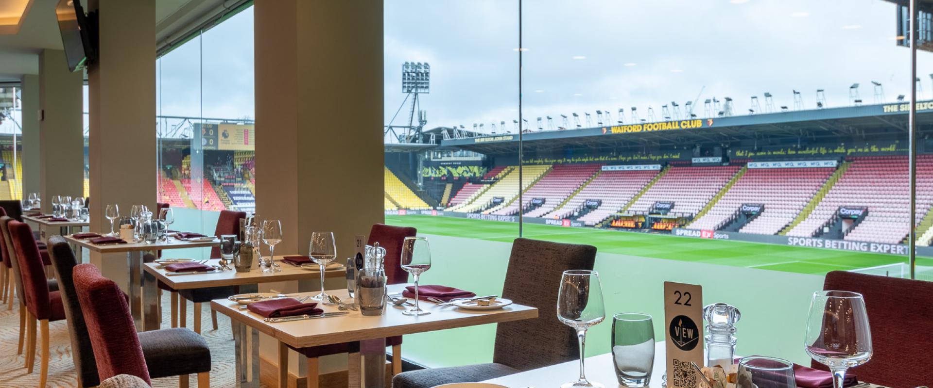Stylish dining area at Watford F.C. with stadium views for corporate events and celebrations.