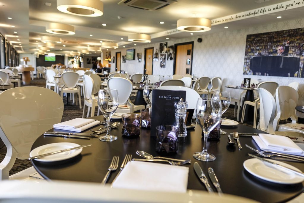 Elegant dining area in Sir Elton John Suite for corporate events and celebrations.