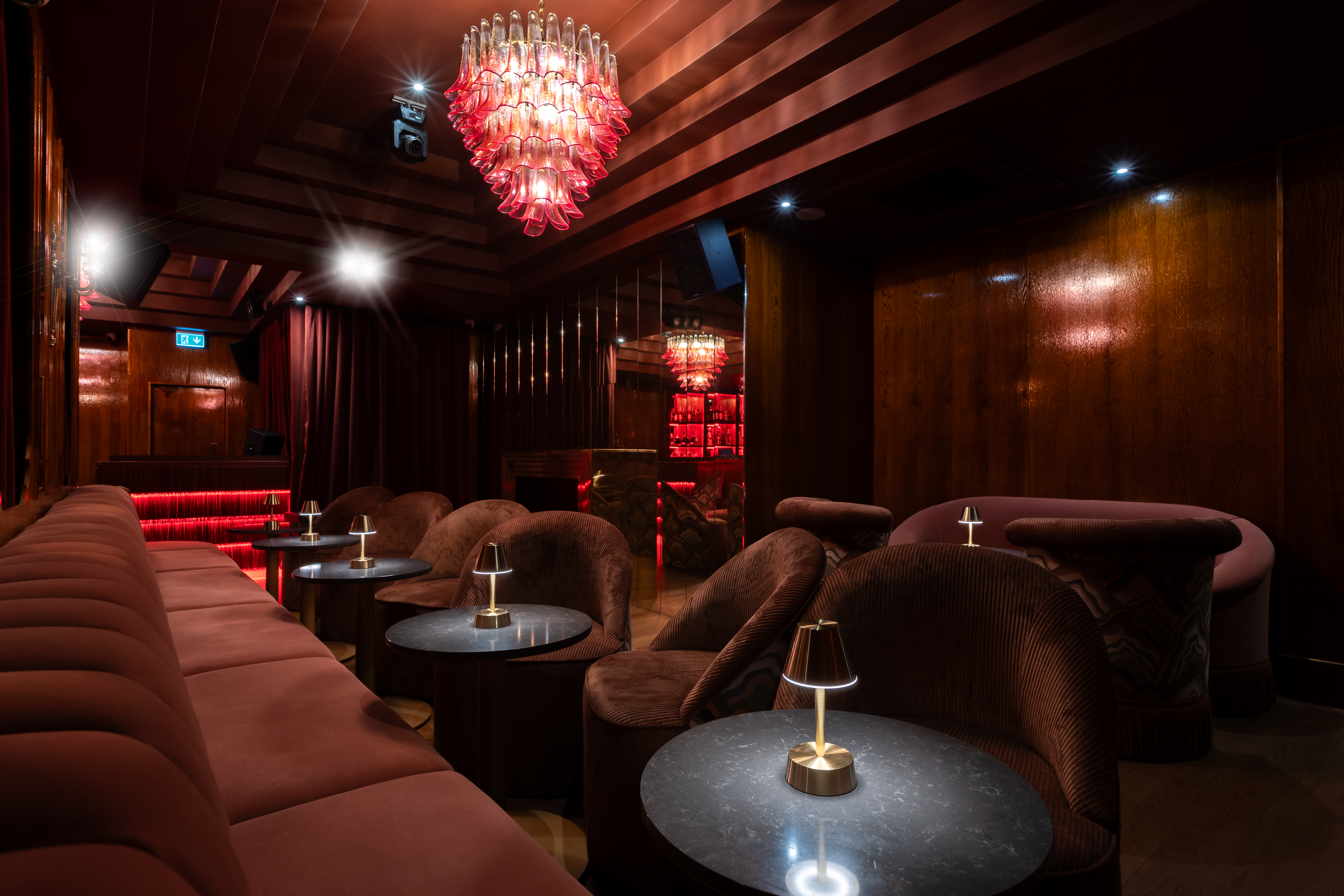 Luxurious lounge with chandelier at Selene Nightclub for upscale events and gatherings.