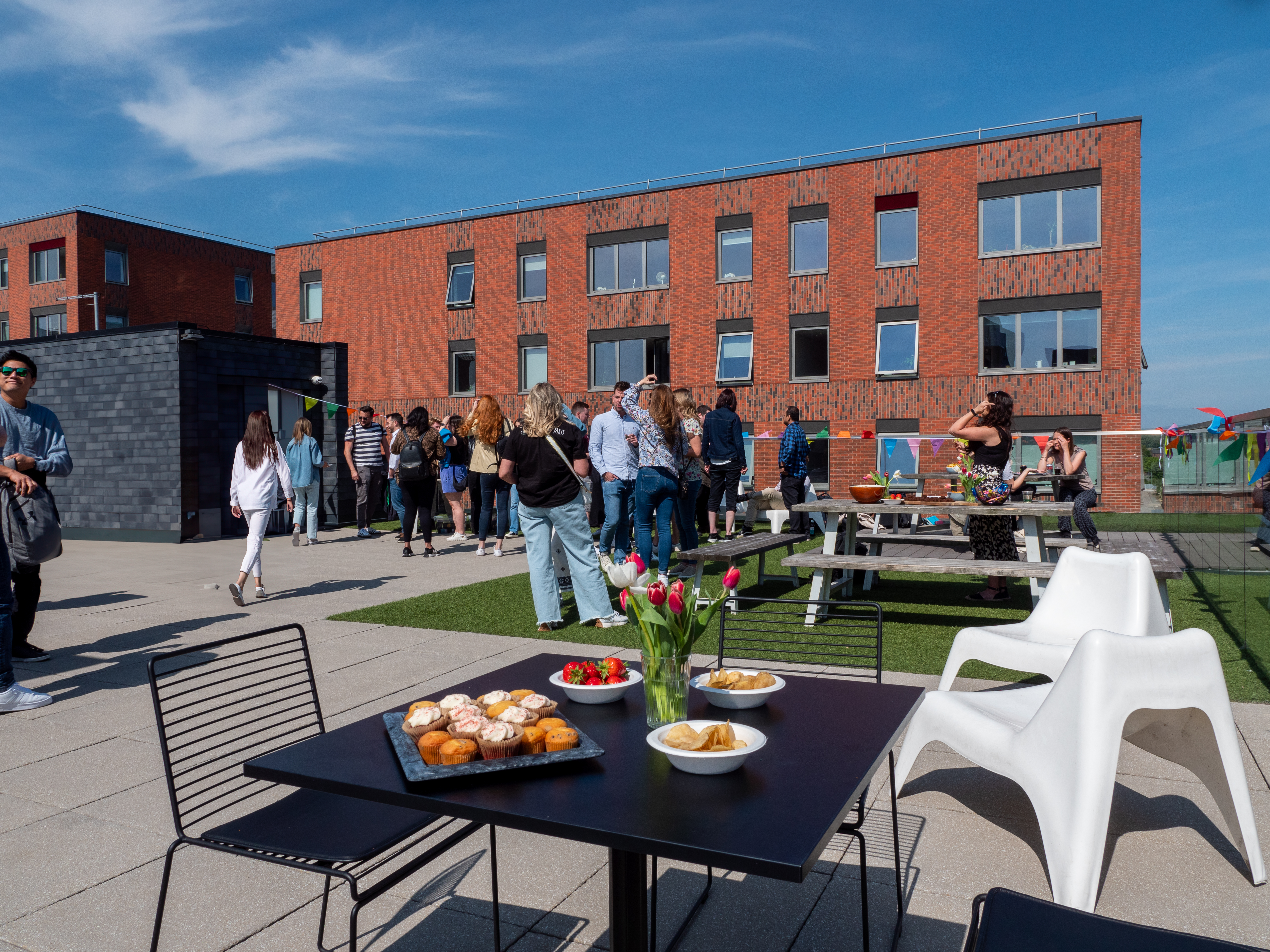 Networking event at Jactin Roof Terrace with modern architecture and inviting refreshments.