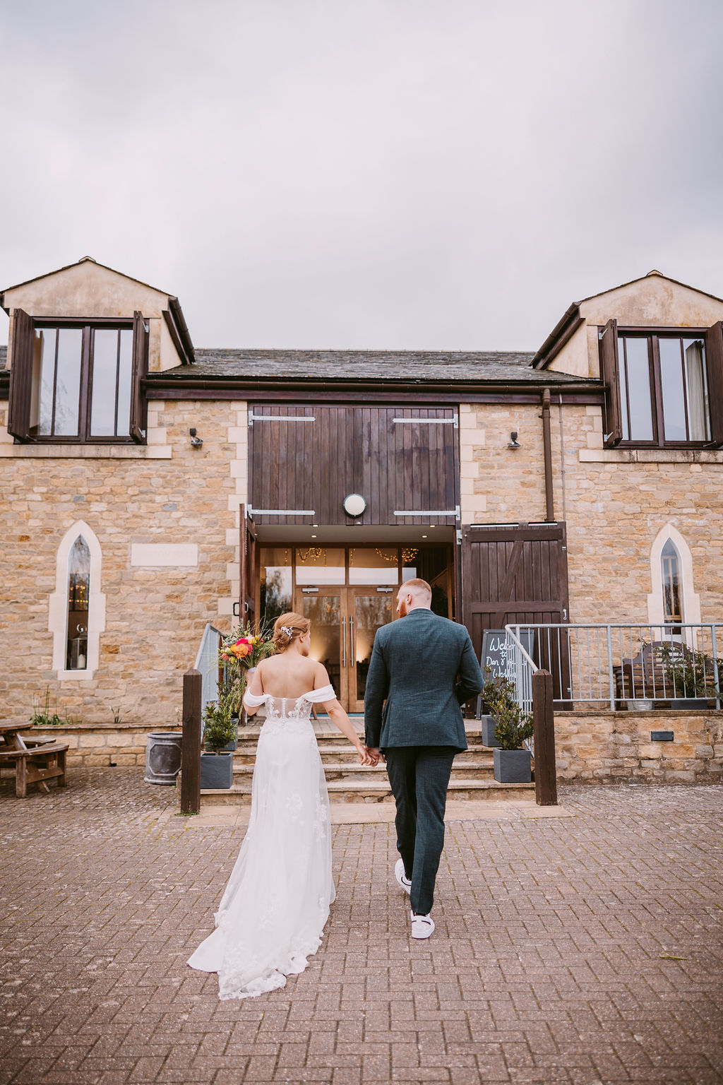 Worton Hall rustic wedding venue entrance, stone barn.