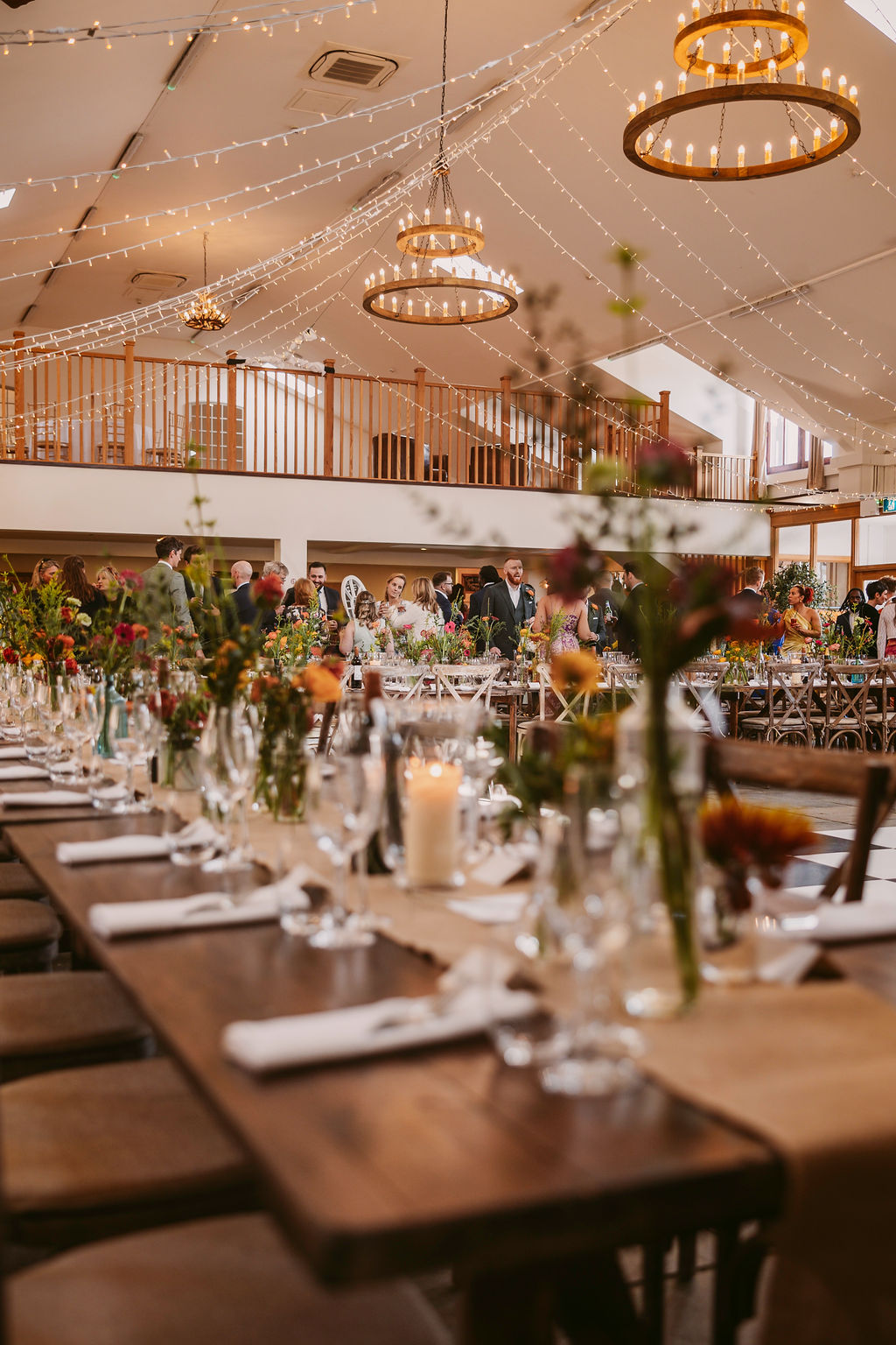 Rustic wedding banquet, Worton Hall, floral centerpieces, ambient lighting