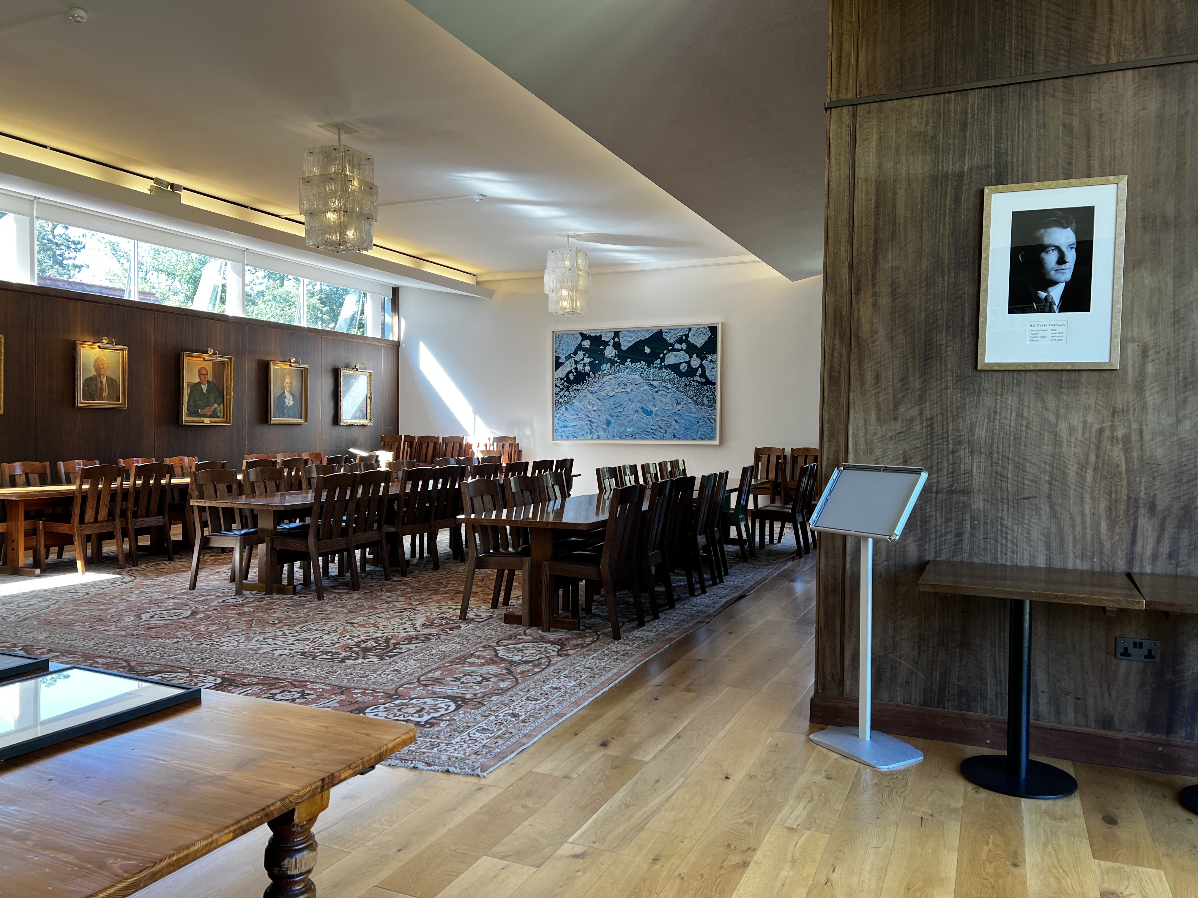 Harrison Room at Selwyn College: elegant venue with wooden interior for meetings and events.