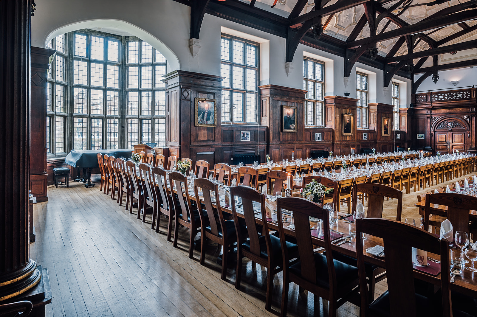 Elegant banquet hall at Selwyn College with wooden beams, perfect for corporate events.