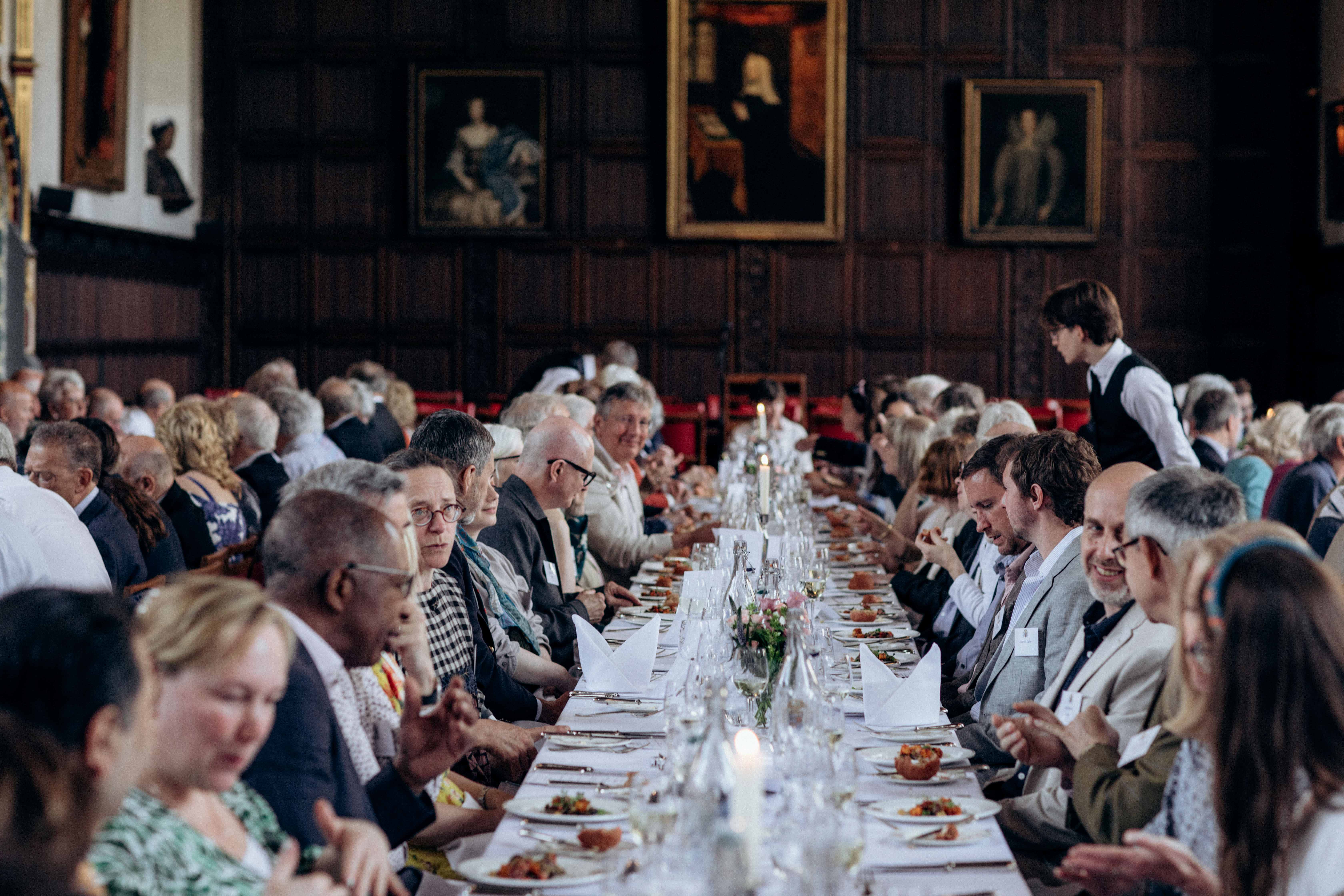 Formal banquet at St John's College Hall with long tables for luxury event venue hire.