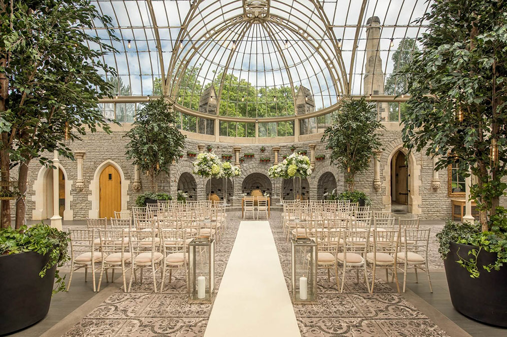 Elegant wedding conservatory, natural light, floral decor