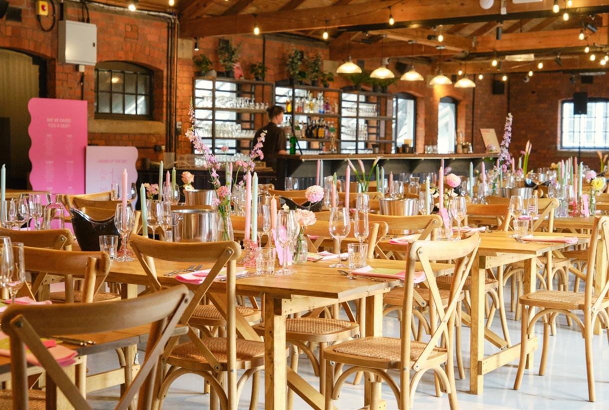 Rustic Tap Room event, pink accents, seating, bar