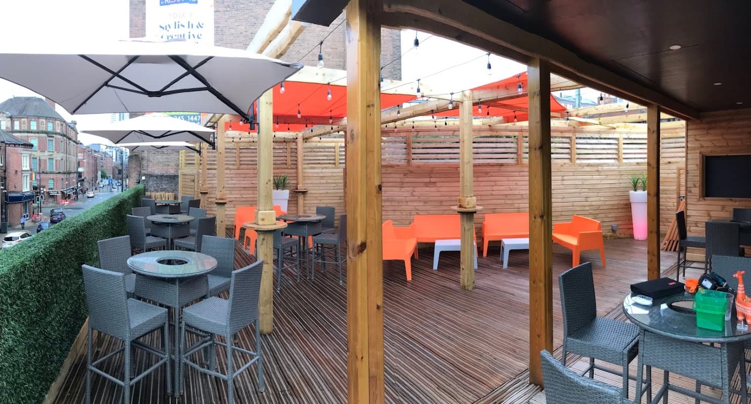 Outdoor beer garden event seating, umbrellas, string lights