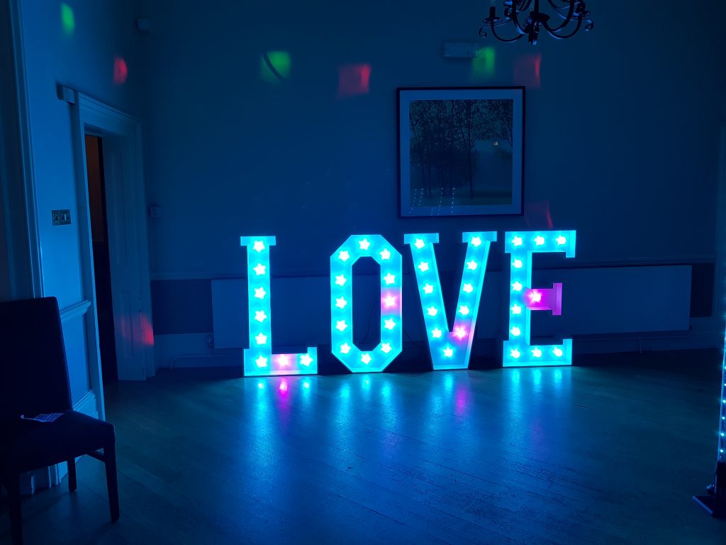 Vibrant "LOVE" display at Loyd Lindsay Rooms for weddings and romantic events.