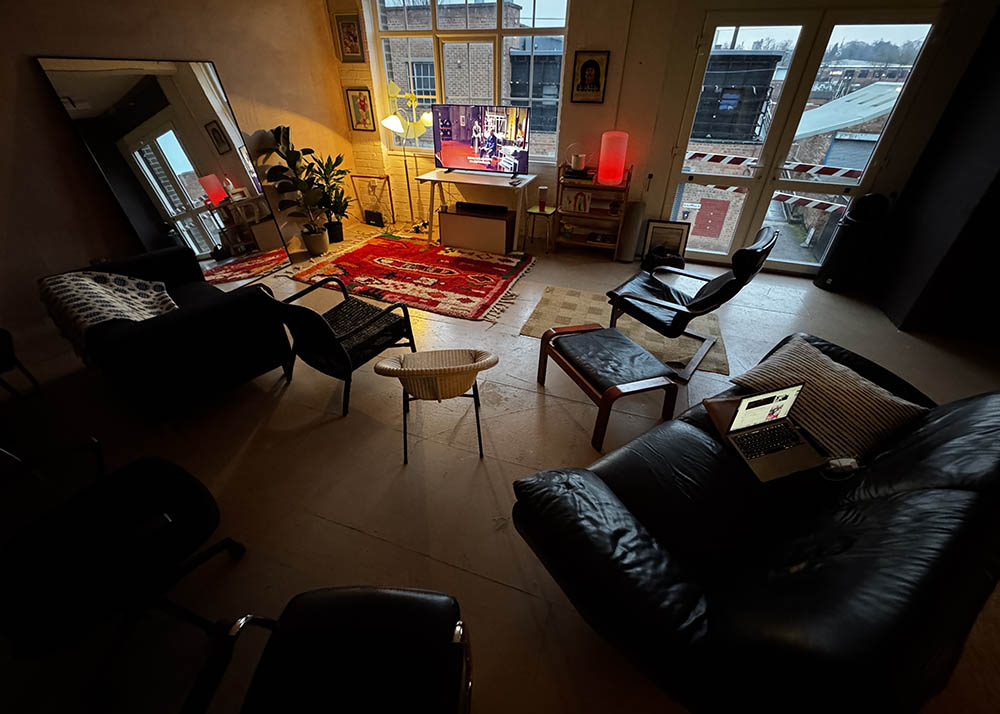 Cozy modern meeting space with natural light for brainstorming and casual events.