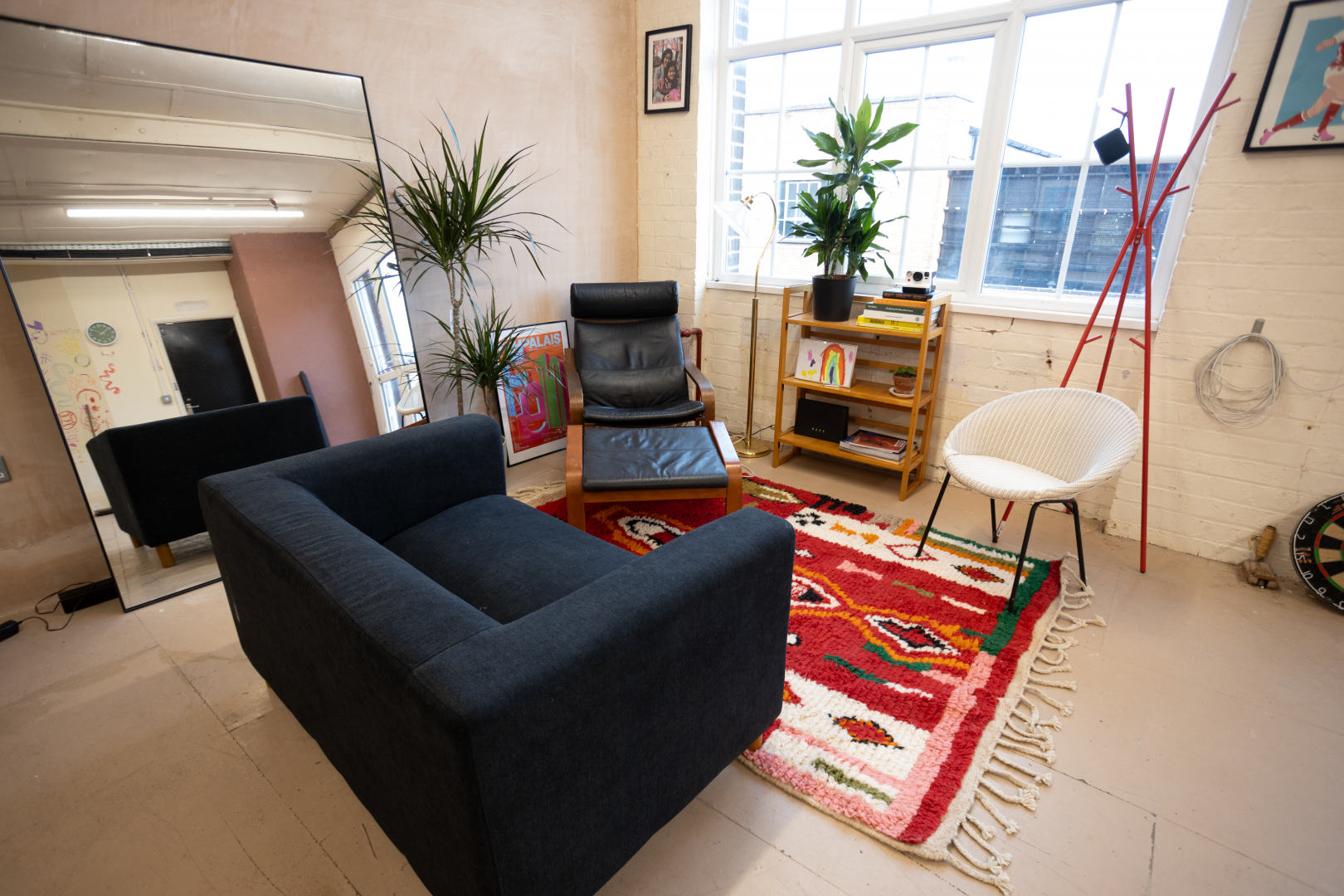 Cozy breakout space with natural light for informal meetings and team-building sessions.