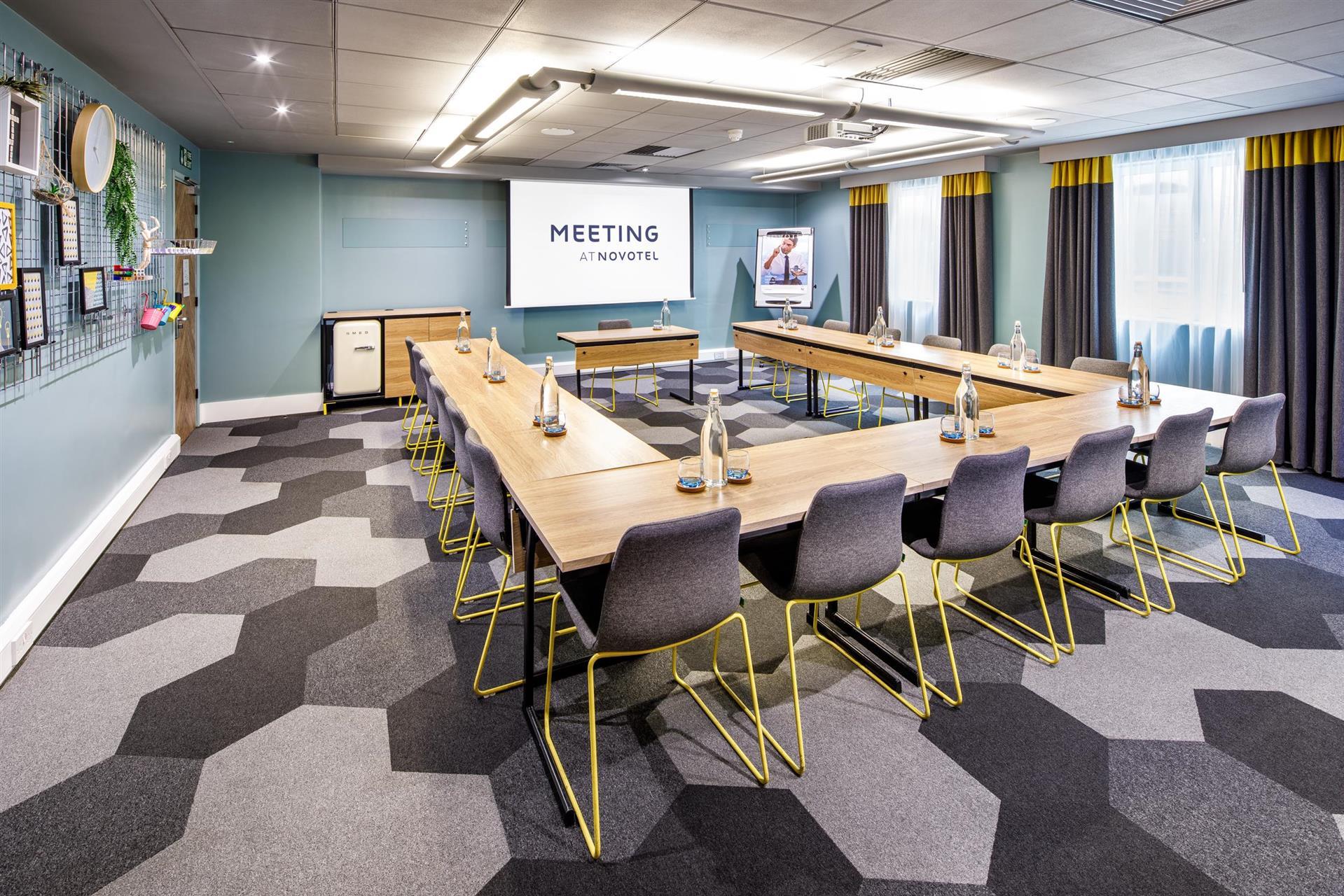 Millennium Suite at Novotel London Bridge, modern U-shaped meeting room for workshops.