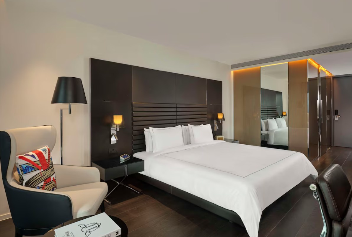 Modern art hotel room in London Hoxton, stylish decor for business travelers' events.