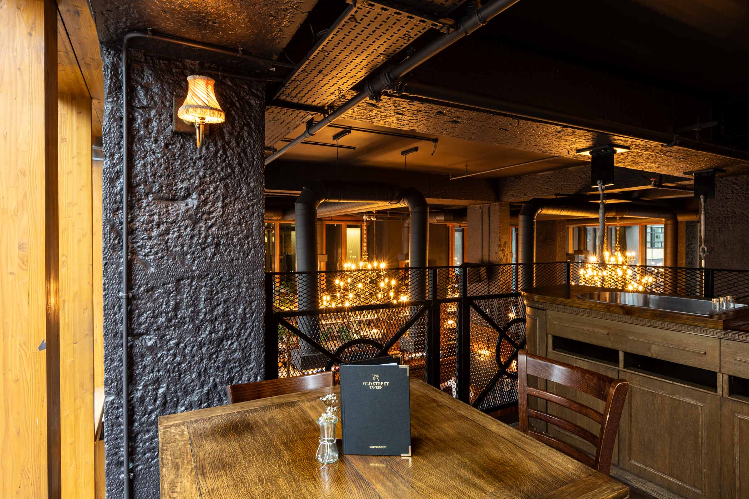 Industrial-chic breakout space in Old Street Tavern for corporate networking and strategy events.