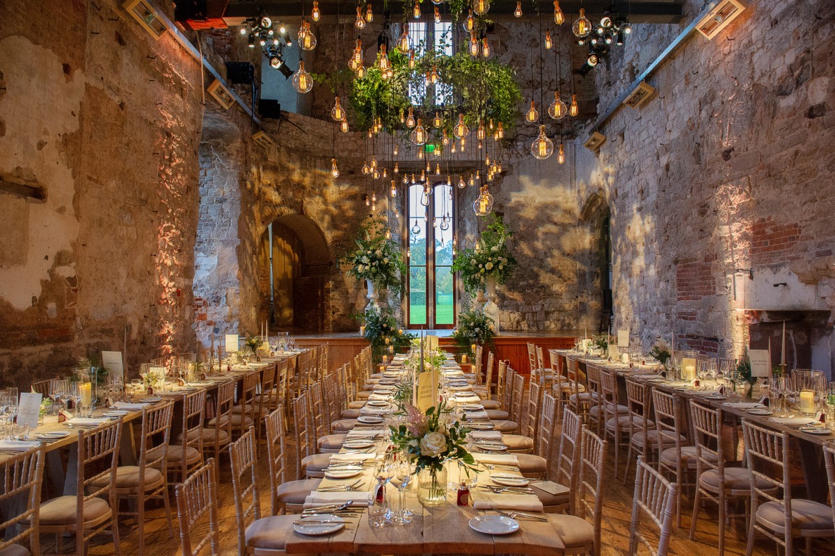 Lulworth House event space with stone architecture and elegant tablescape for luxury corporate gala.