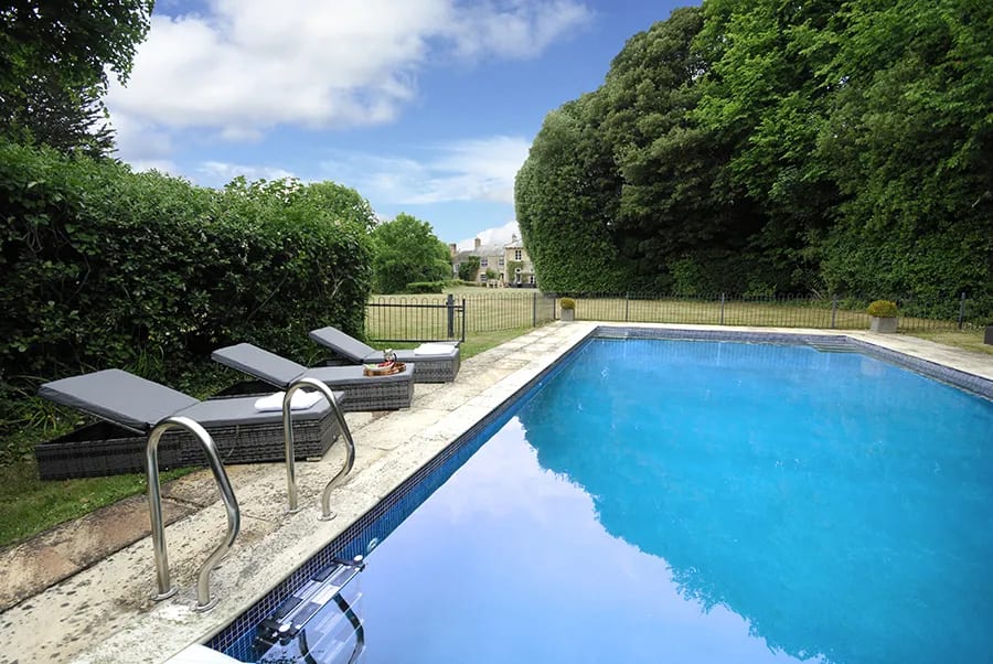 Serene poolside at Haygrass House, ideal for outdoor events and summer gatherings.